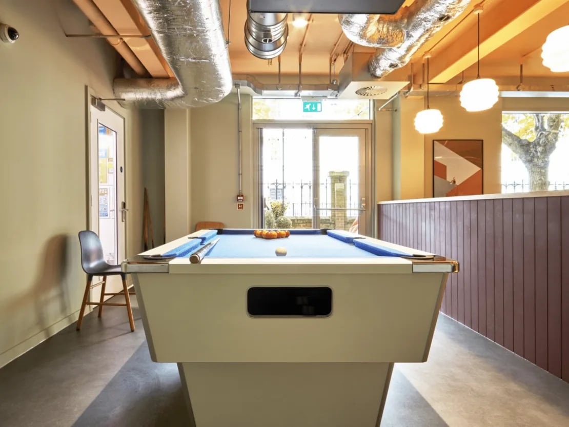 Pool table with balls and chair communal area at Queen Street Studios in Exeter Student Accommodation