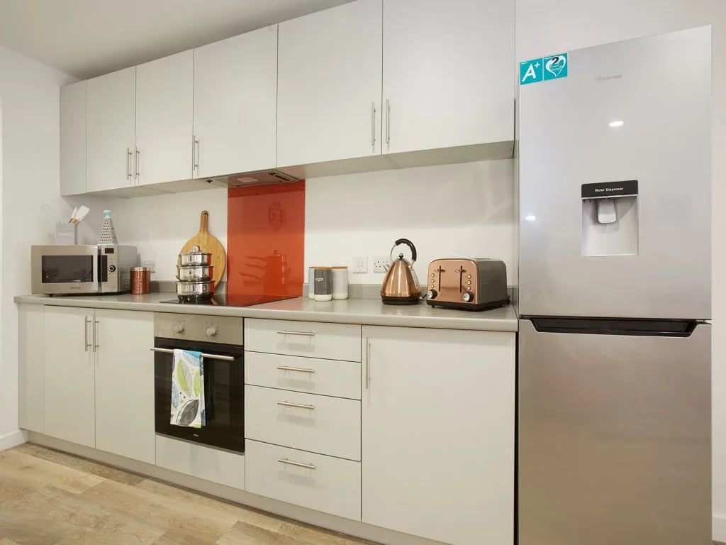 Modern kitchen with microwave oven toaster fridge kitchen at The Shield in Newcastle Upon Tyne Student Accommodation