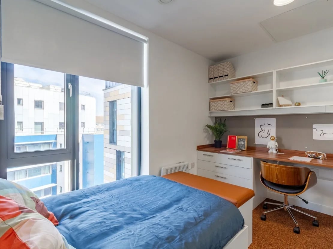 Bed desk shelves and chair bedroom at The Shield in Newcastle Upon Tyne Student Accommodation