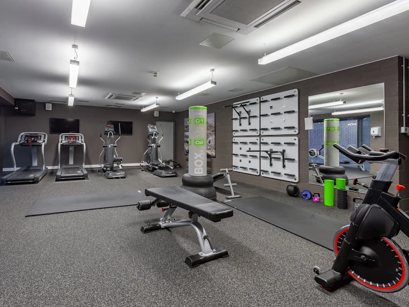 Gym equipment treadmills ellipticals punching bag gym area at The Fitzalan in Cardiff Student Accommodation