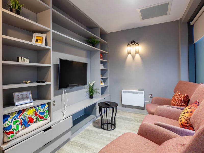 Shelves TV couch and heater lounge area at The Fitzalan in Cardiff Student Accommodation