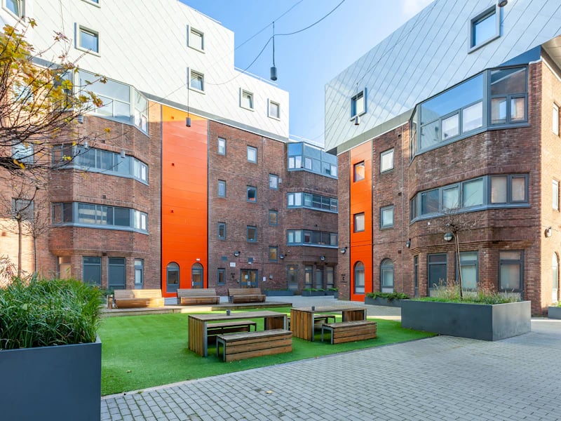 Courtyard with benches and picnic tables Exterior at The Fitzalan in Cardiff Student Accommodation