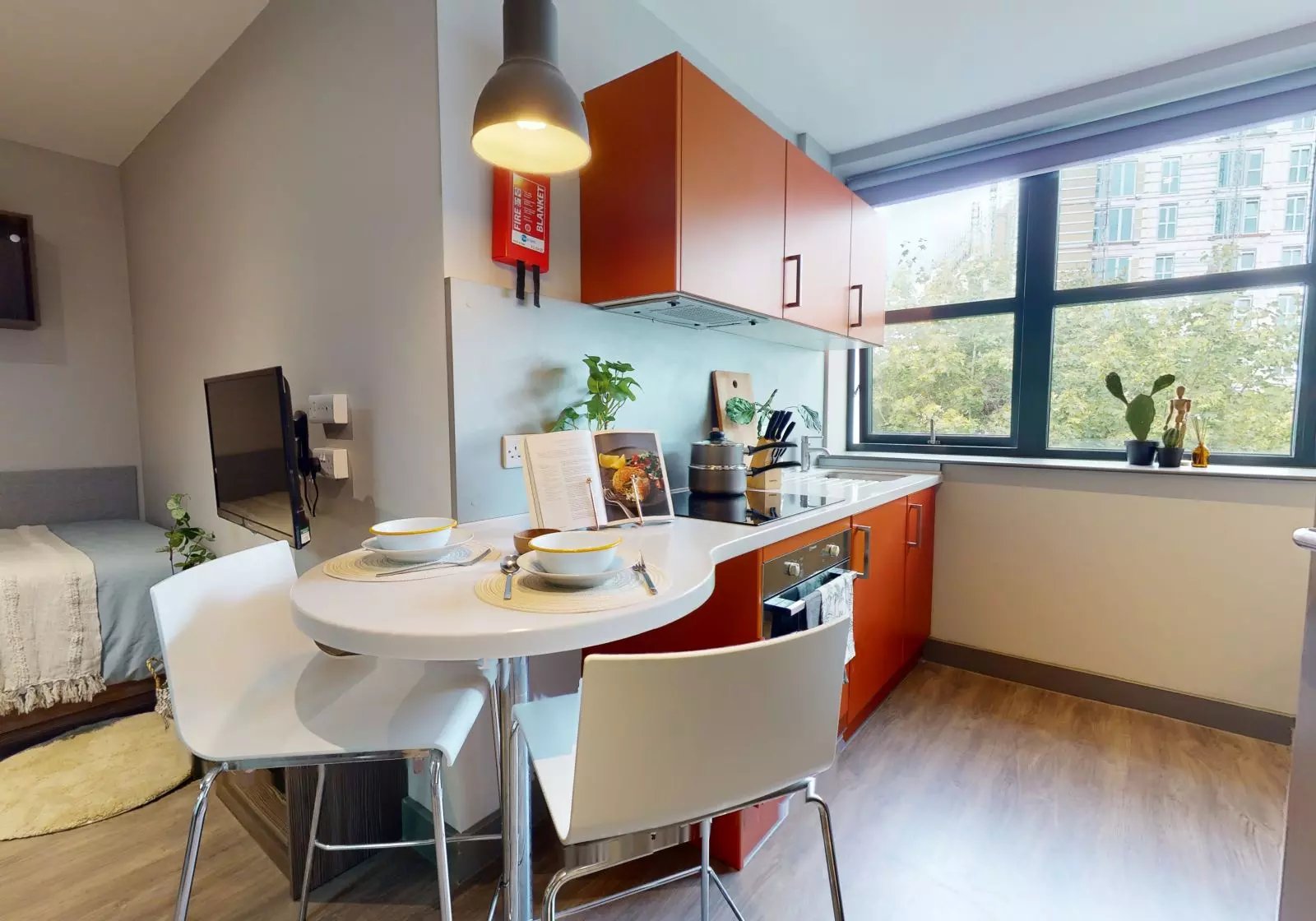 Kitchenette with dining table and bed bedroom and kitchen at Waterlane House in Bristol Student Accommodation