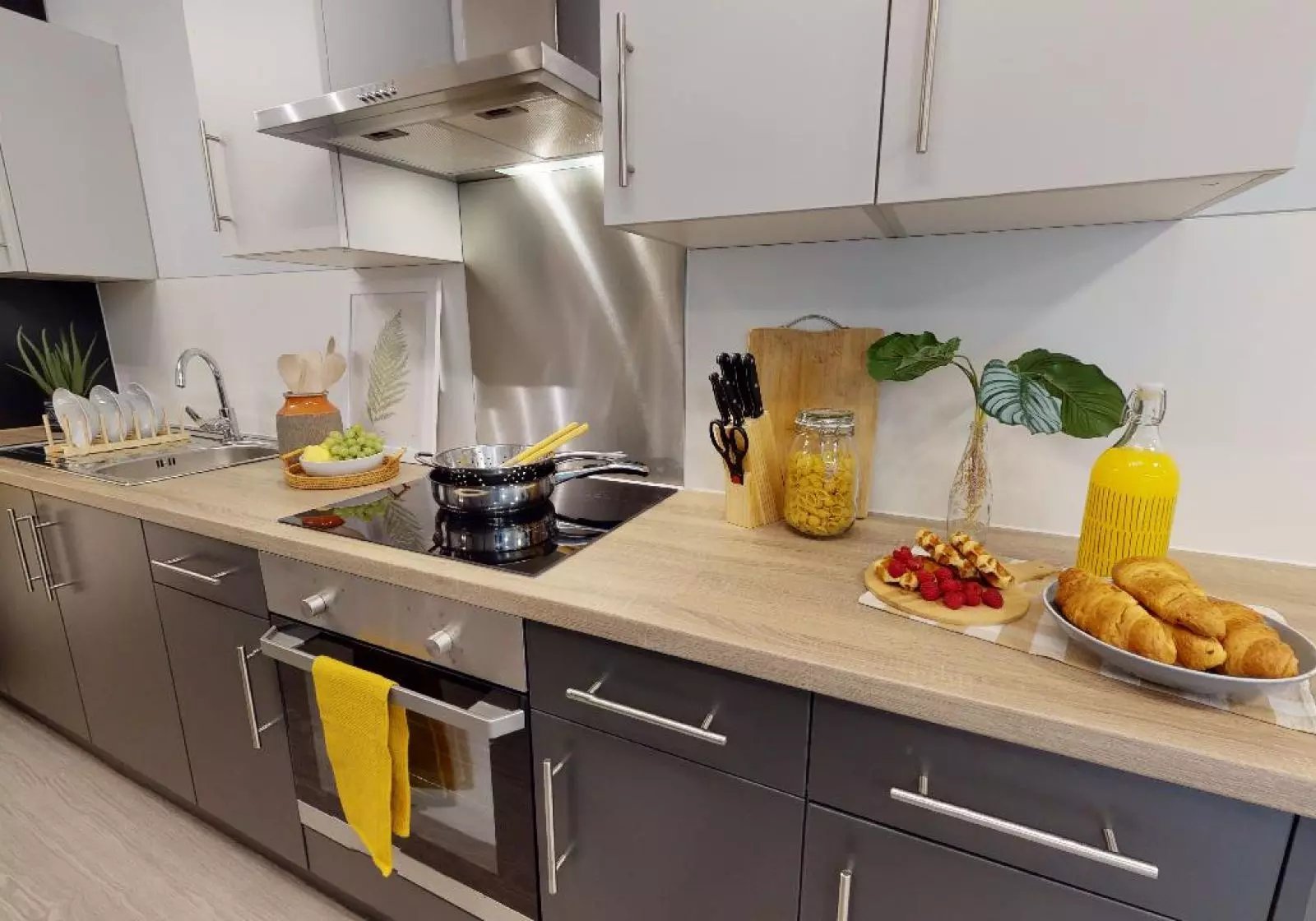 Countertop with food and cookware kitchen at iQ Will Wyatt Court in London Student Accommodation