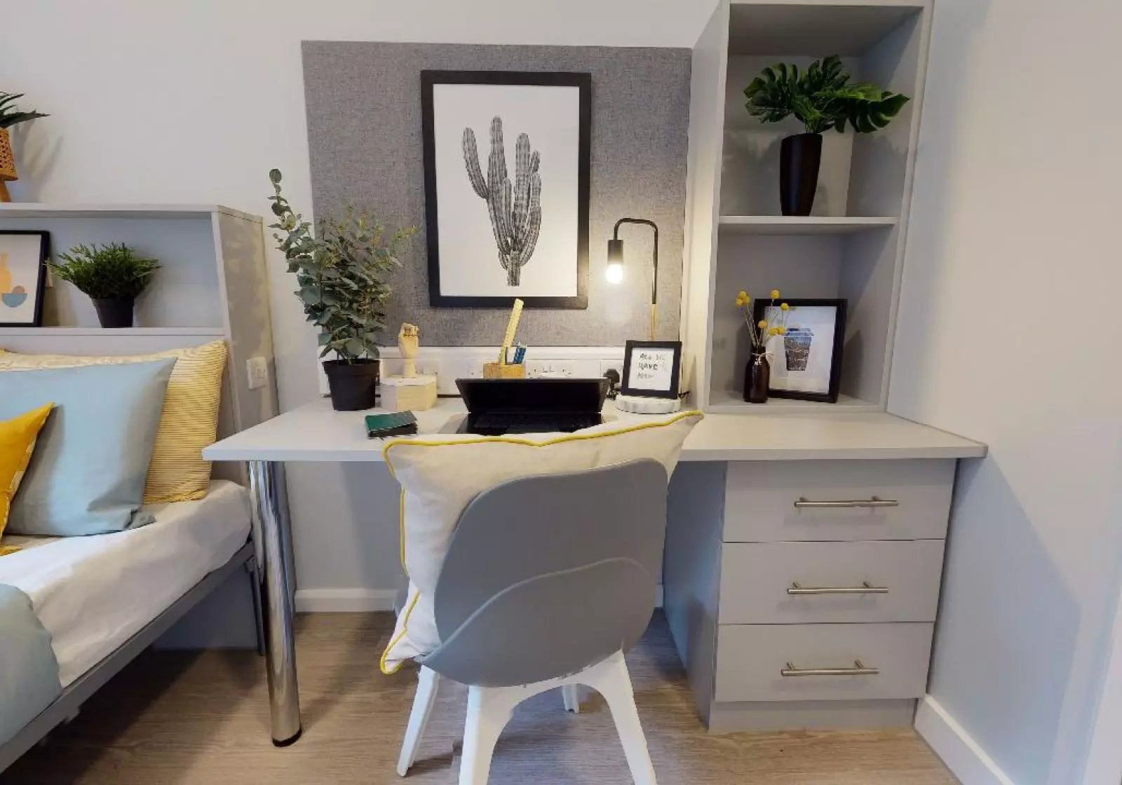 Desk with chair plants and bed study area at iQ Will Wyatt Court in London Student Accommodation