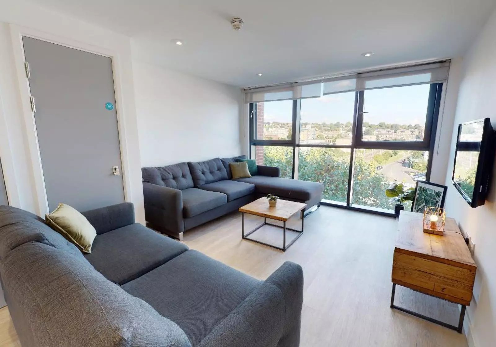 Sectional sofa coffee table television living room at iQ Haywood House in London Student Accommodation
