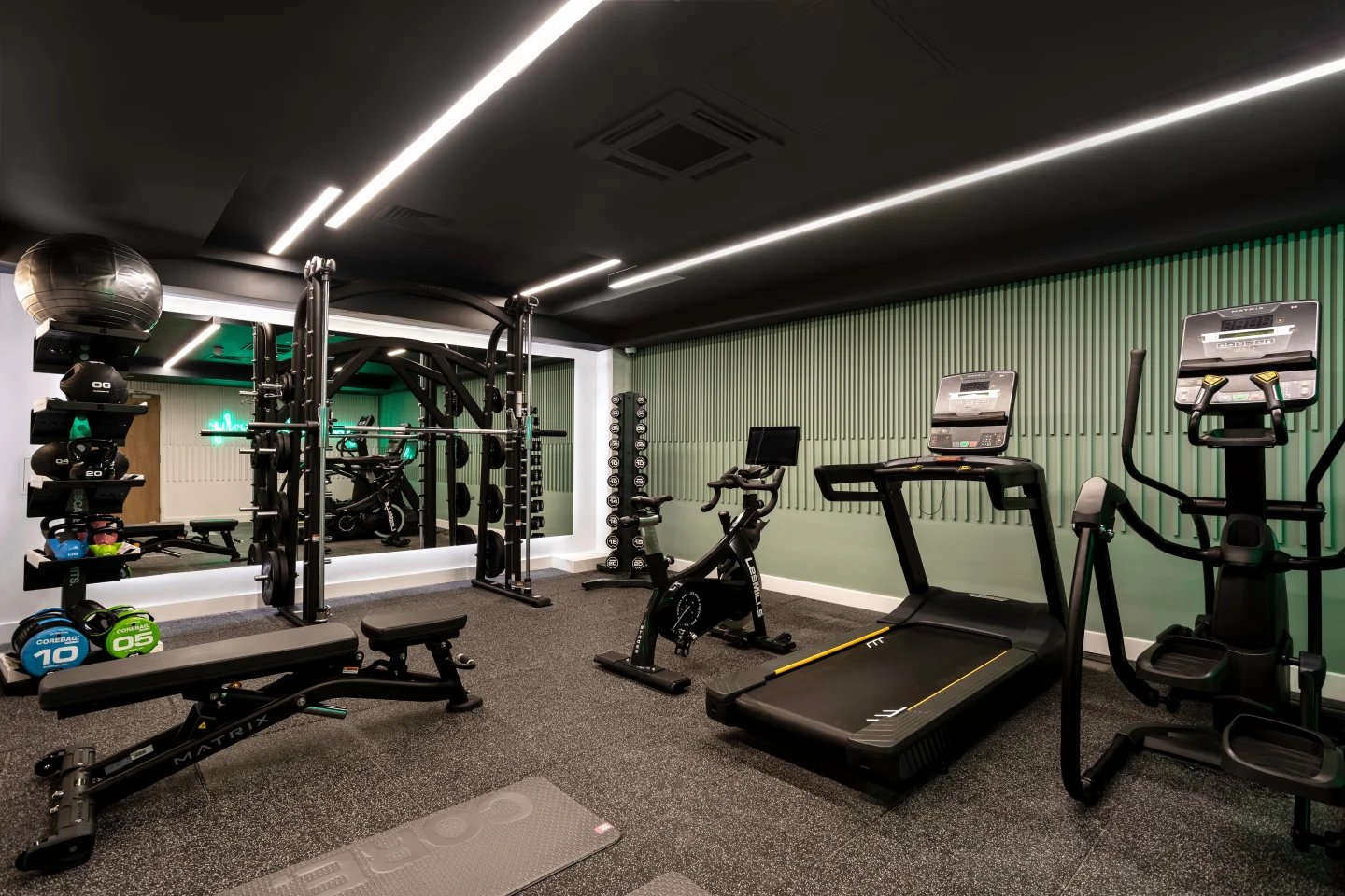Weight rack treadmill exercise bike gym playing area at Aster House in Belfast Student Accommodation