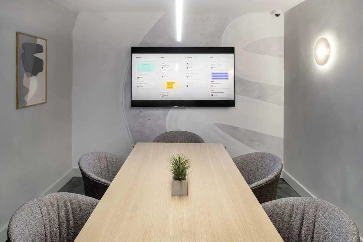 Table chairs monitor art modern meeting room at Aster House in Belfast Student Accommodation