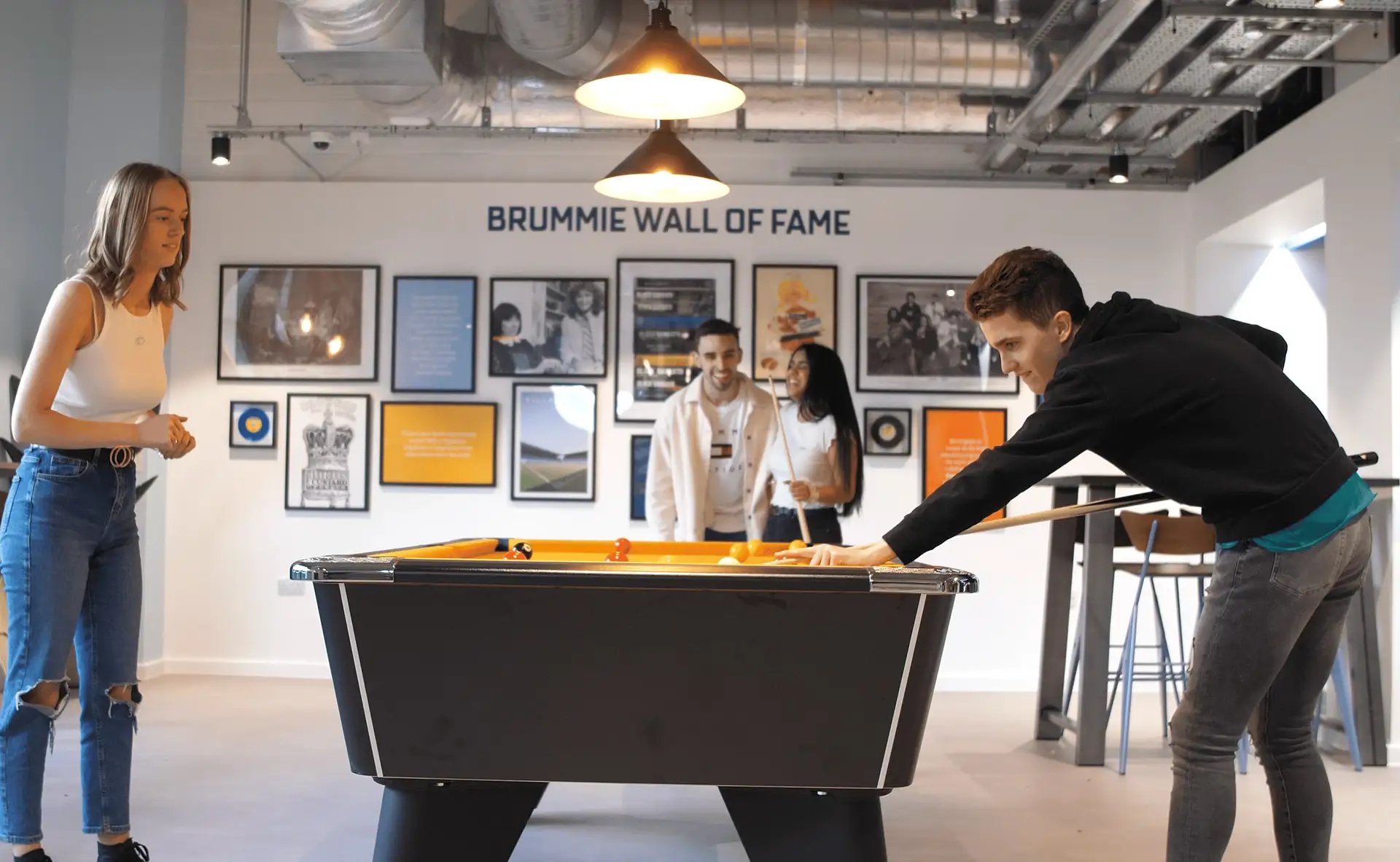 Students playing pool on pool table common room at Altura Birmingham in Birmingham Student Accommodation