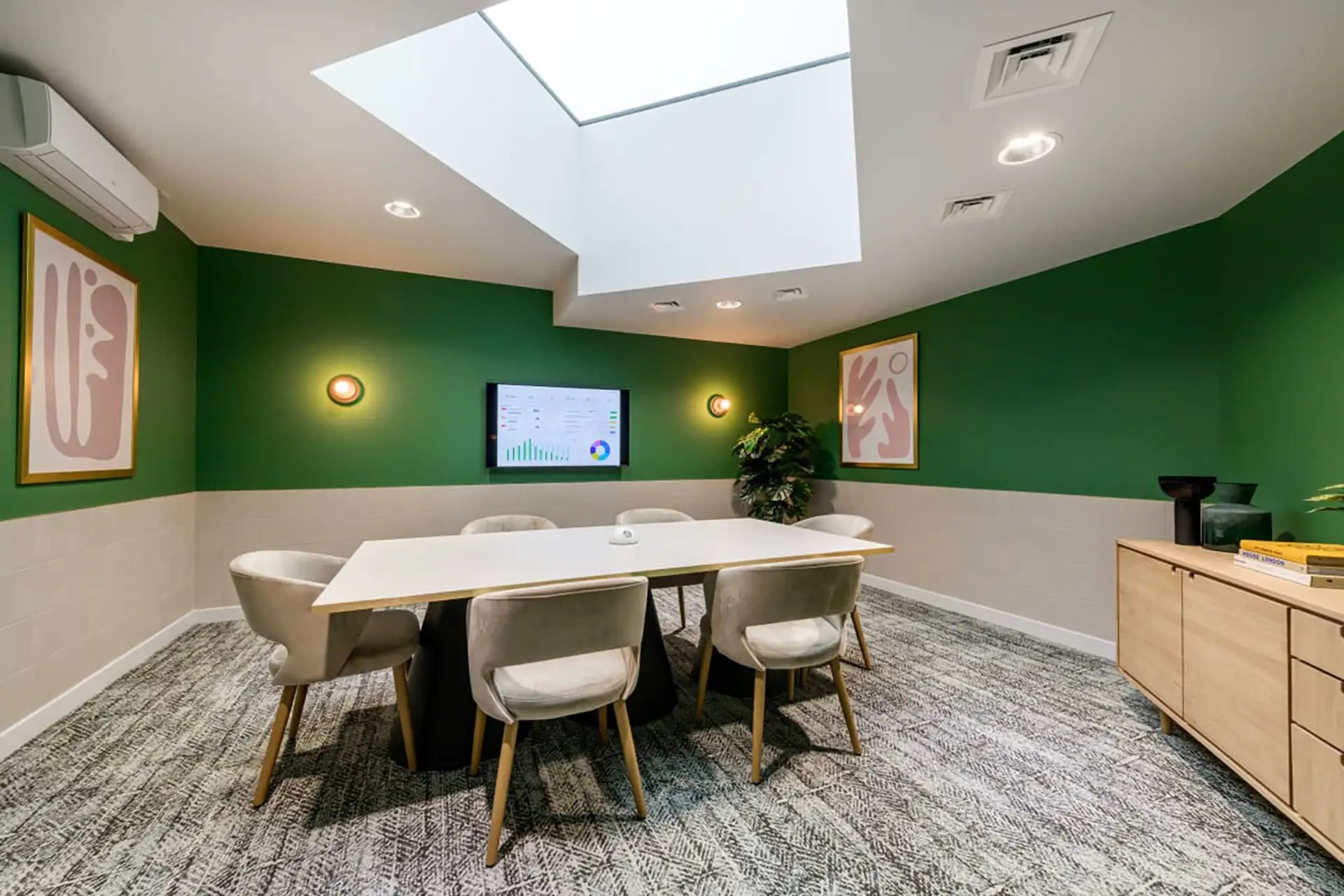 Conference room with table chairs screen artwork and skylight conference room at Wick Park in London Student Accommodation