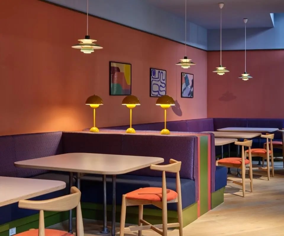 Booths tables and chairs communal area at Scape Canada Water in London Student Accommodation