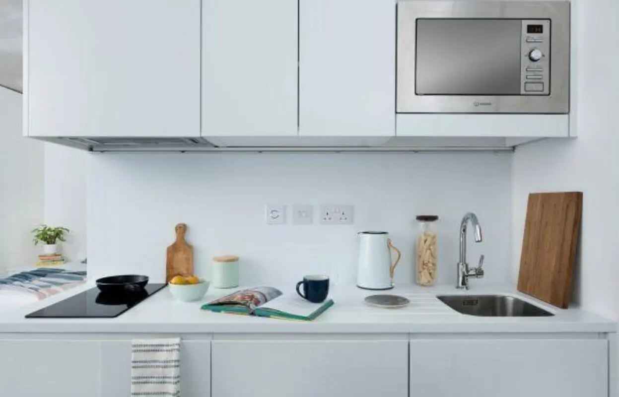 Countertop with kettle sink and cutting board kitchen at Scape Mile End Canalside in London Student Accommodation