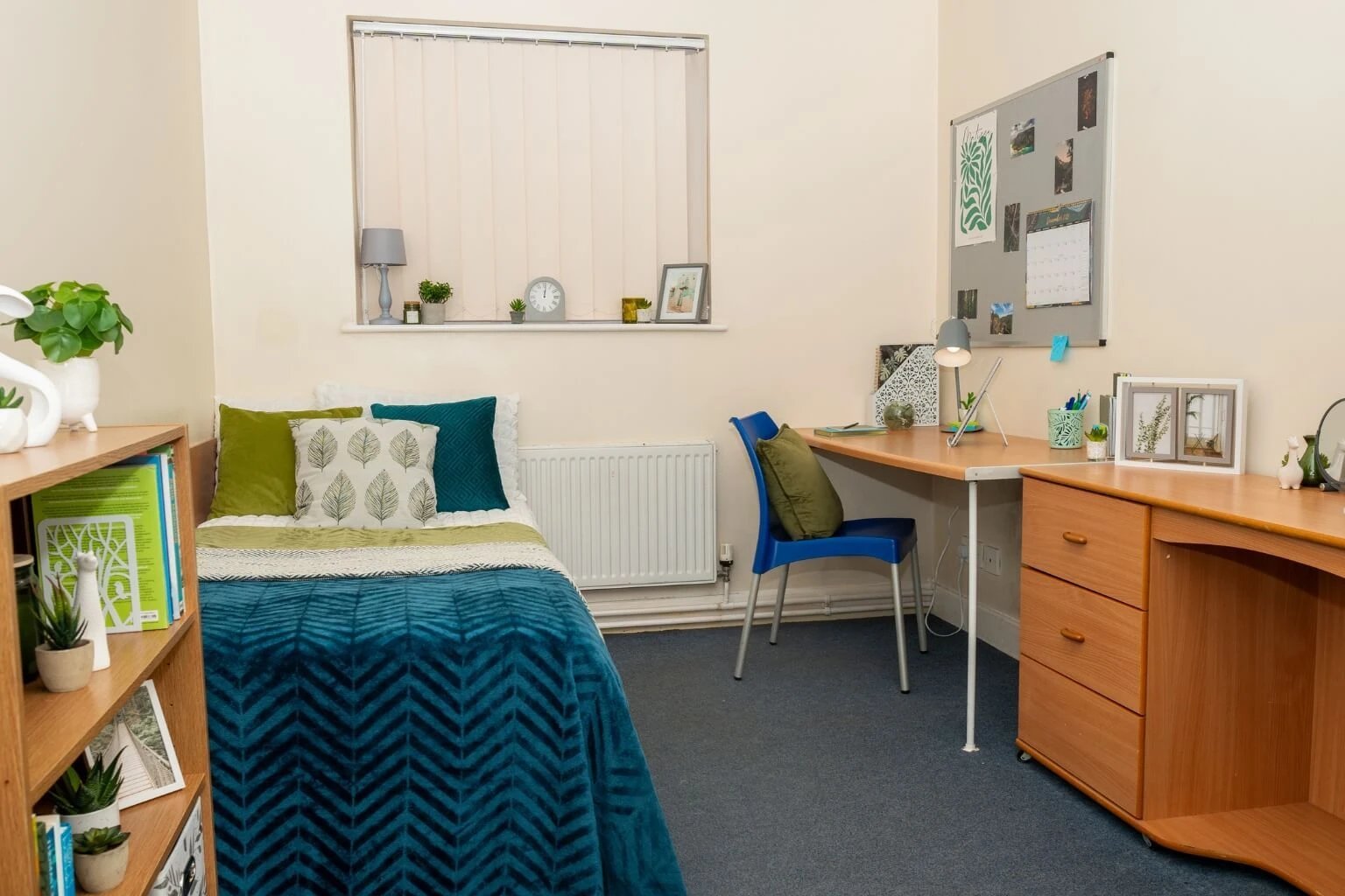 Bed desk pillows and shelf bedroom interior at Grange Court & The Ridings in Ormskirk Student Accommodation