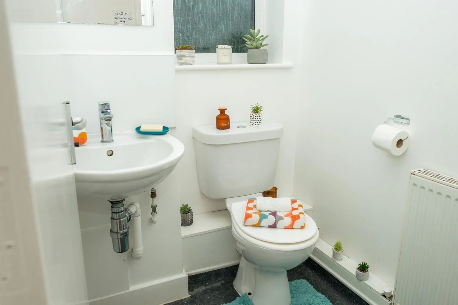 Sink toilet and towel bathroom image at Grange Court & The Ridings in Ormskirk Student Accommodation