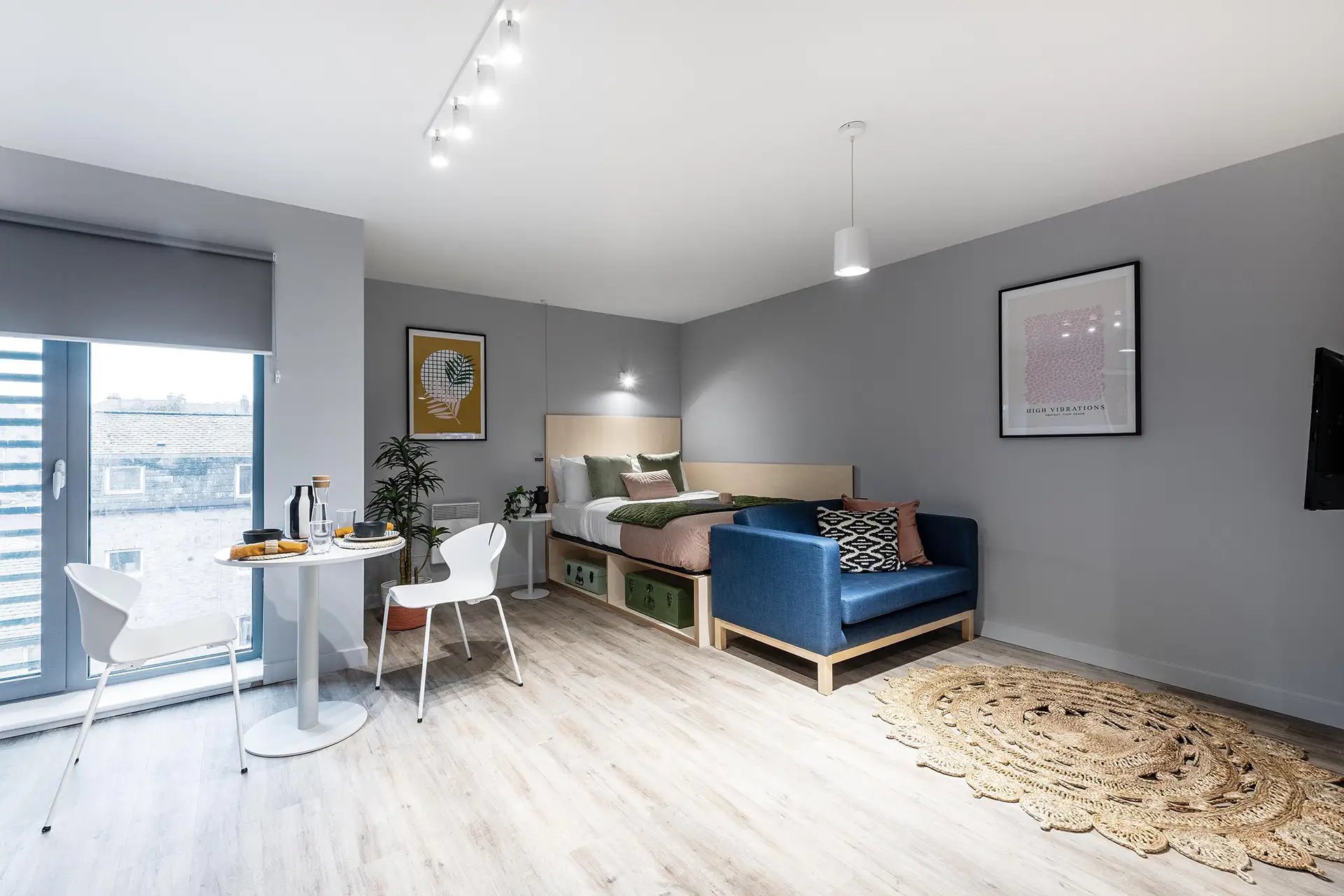 Bed sofa table chairs rug living room at Huxley Studios in Edinburgh Student Accommodation