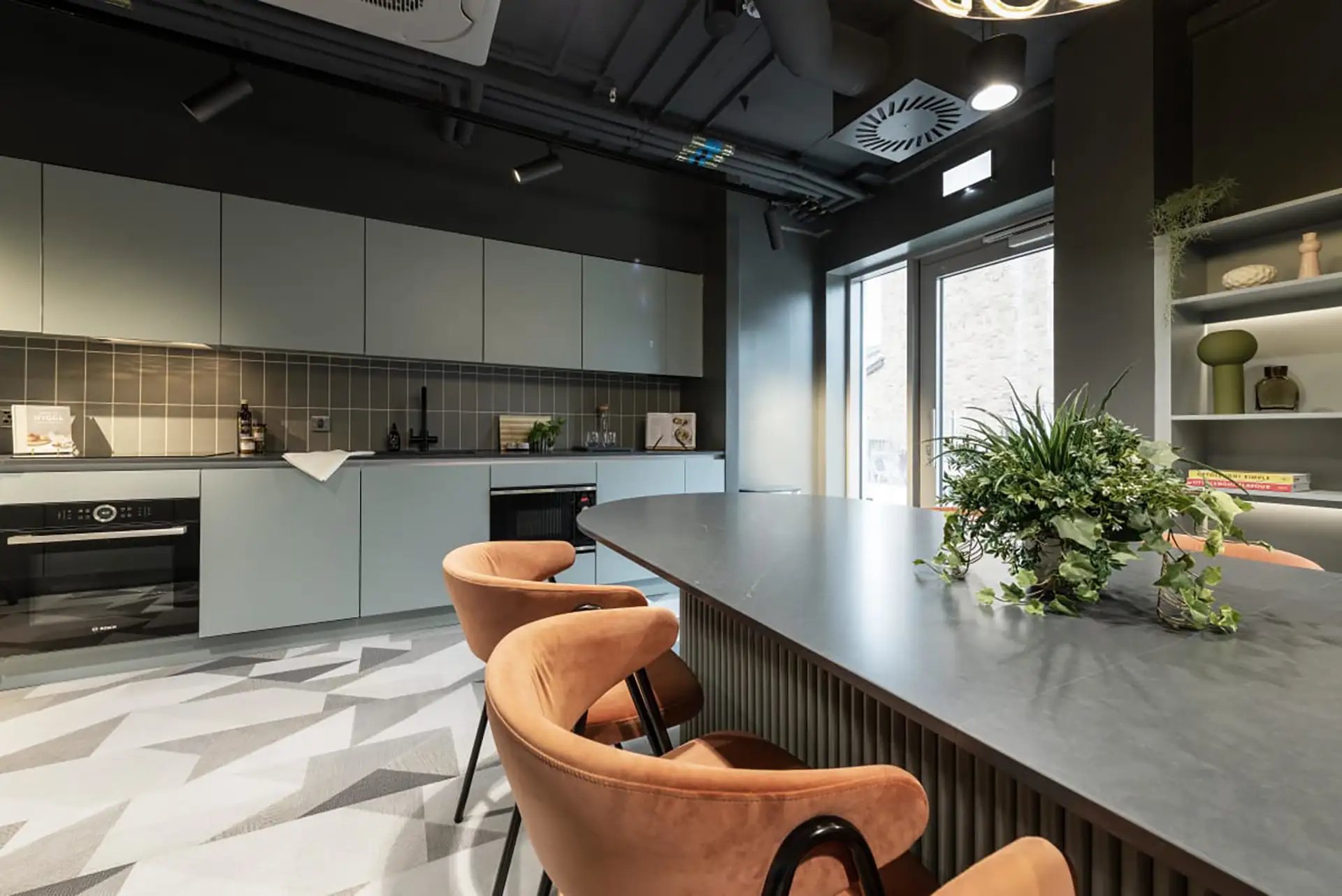 Modern kitchen with pale cabinets and island kitchen at Huxley Studios in Edinburgh Student Accommodation