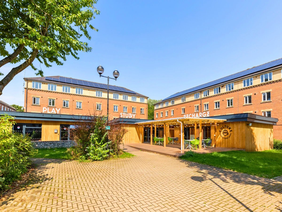 Modern student accommodation buildings with patio area exterior at The Leather Works in Leeds Student Accommodation