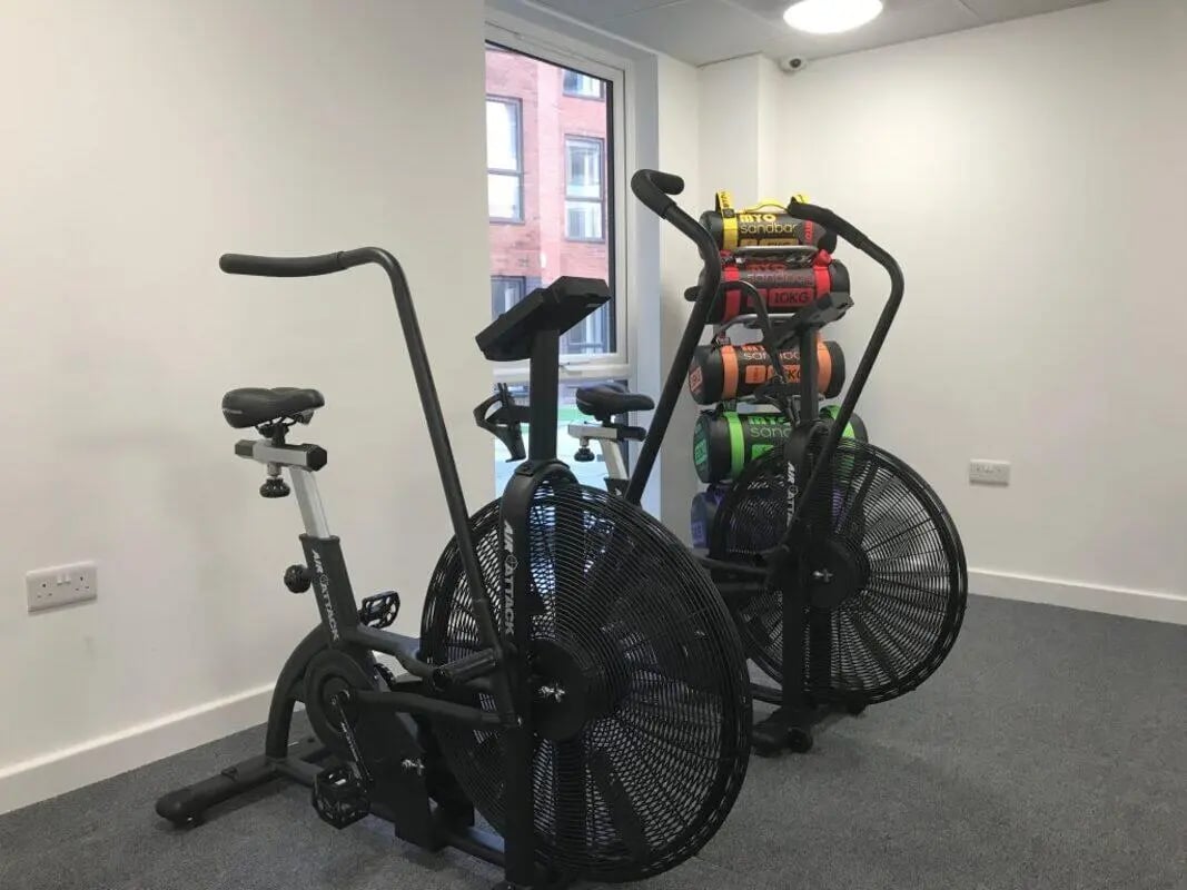 Two exercise bikes and sandbags gym at Q Studios in Stoke-On-Trent Student Accommodation