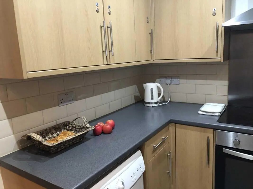 Kitchen counter with kettle basket fruit washing machine kitchen at Norflok Street in Sunderland Student Accommodation
