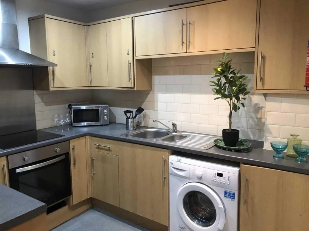 Kitchen with oven microwave sink washing machine kitchen at Norflok Street in Sunderland Student Accommodation