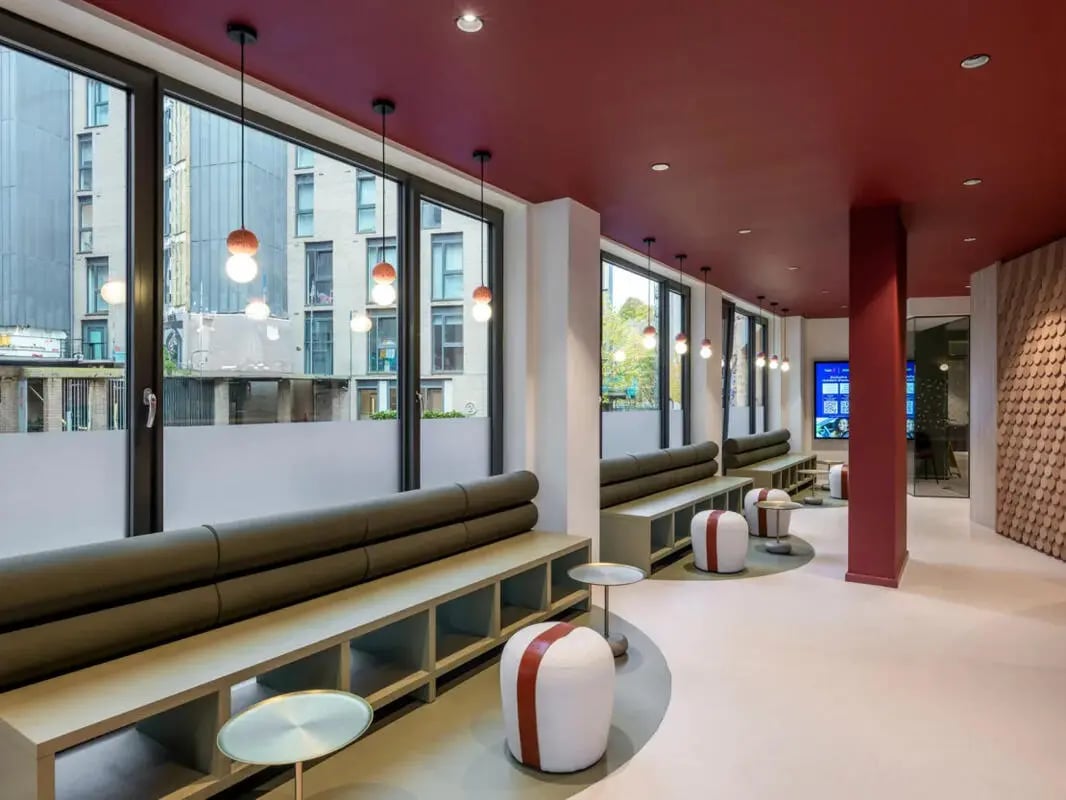 Modern communal area with benches and seating living room at Dunaskin Mill in Glasgow Student Accommodation