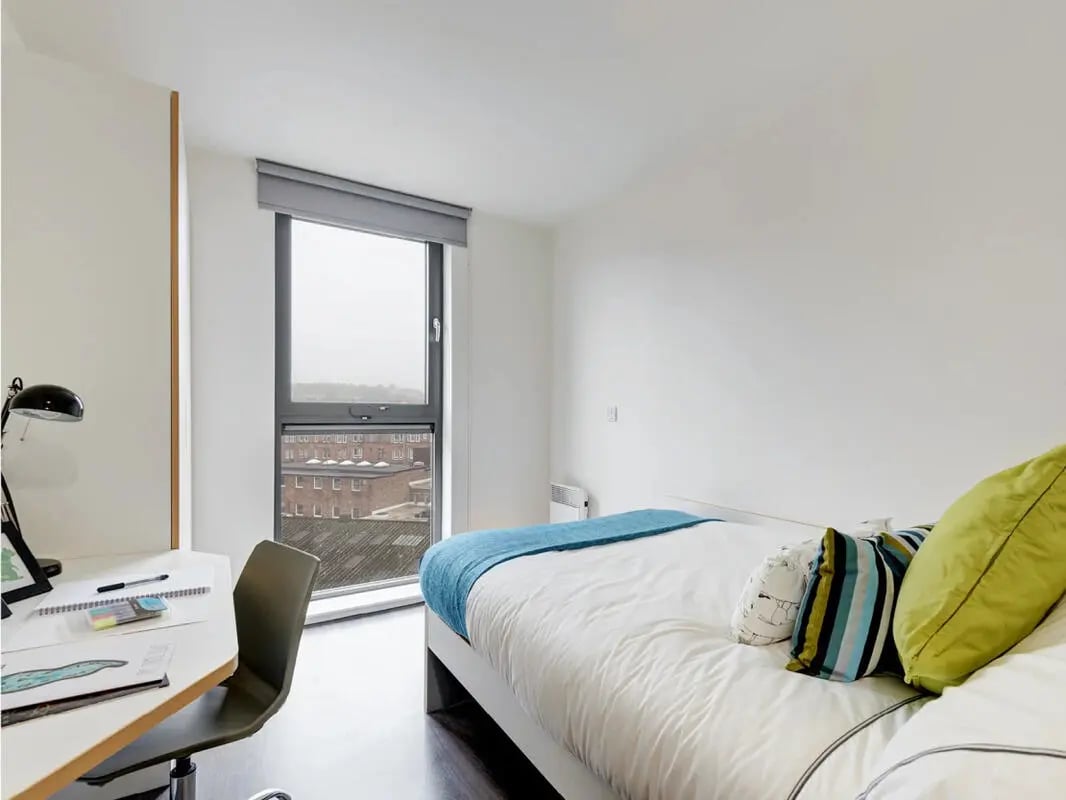 Bed desk and window in student room Bedroom at Dunaskin Mill in Glasgow Student Accommodation