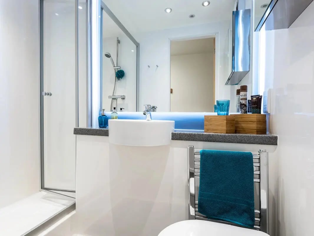 Shower sink towel rack and toiletries bathroom at Dunaskin Mill in Glasgow Student Accommodation