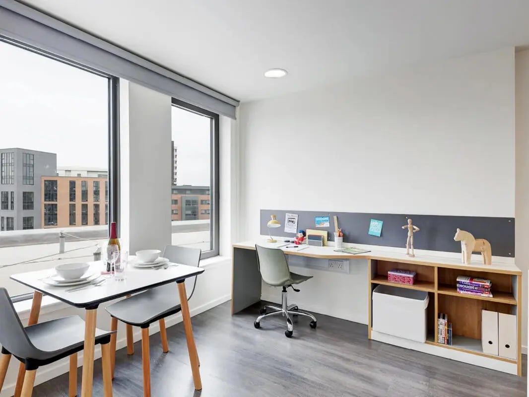 Dining table desk shelves and chair study area at Dunaskin Mill in Glasgow Student Accommodation