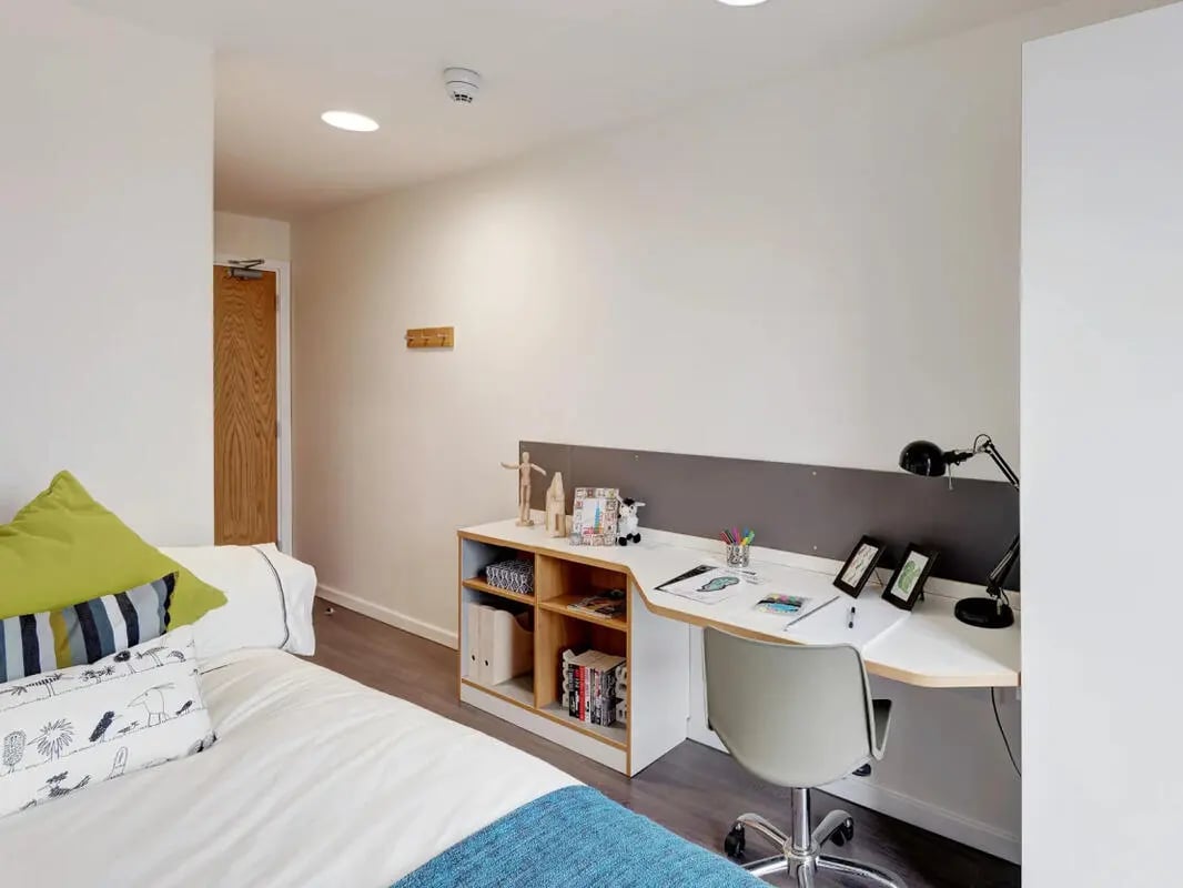 Bed desk shelving and chair bedroom study area at Dunaskin Mill in Glasgow Student Accommodation