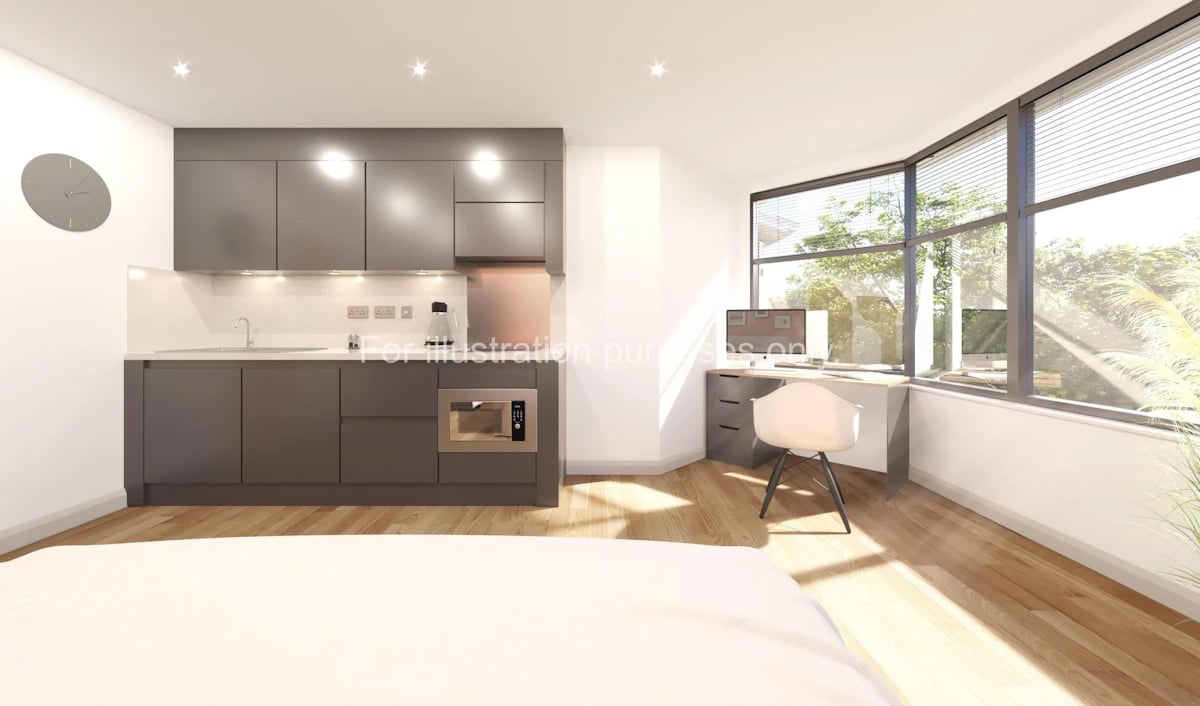 Modern studio kitchen desk and chair living area at Headrow Court in Leeds Student Accommodation