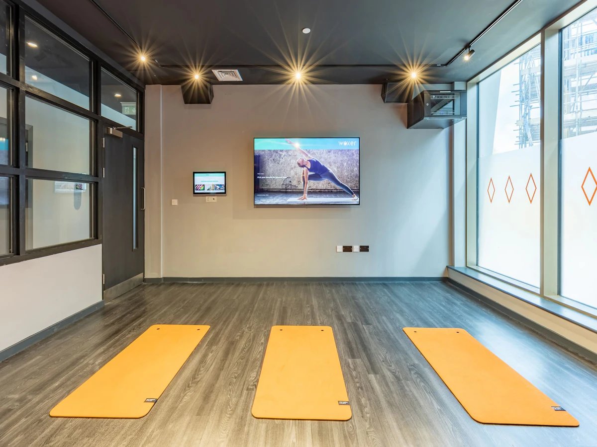 Yoga mats and screen in room gym at Limelight in Liverpool Student Accommodation