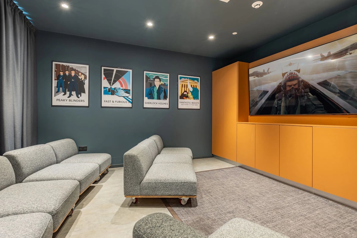 Sofas movie posters and large screen TV living room at Limelight in Liverpool Student Accommodation