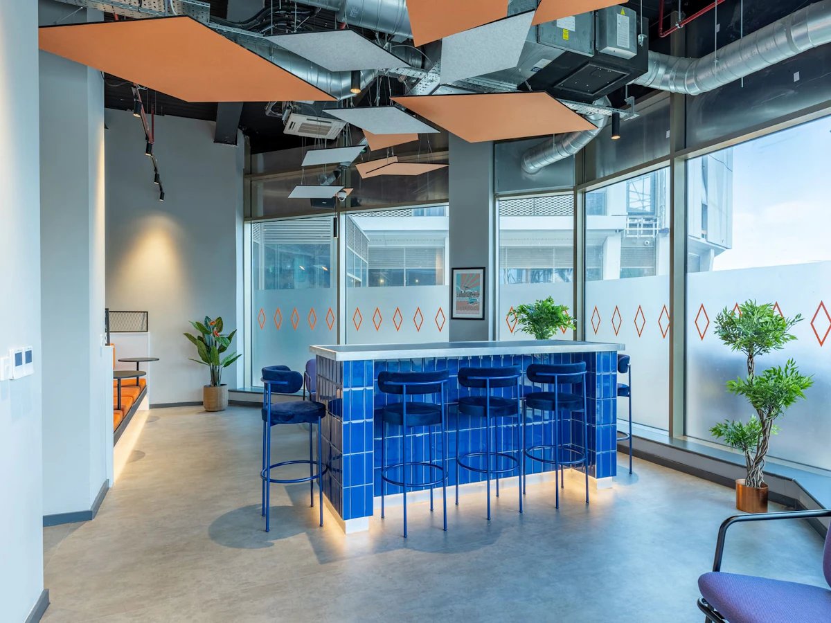 Blue tiled bar with stools communal area at Limelight in Liverpool Student Accommodation