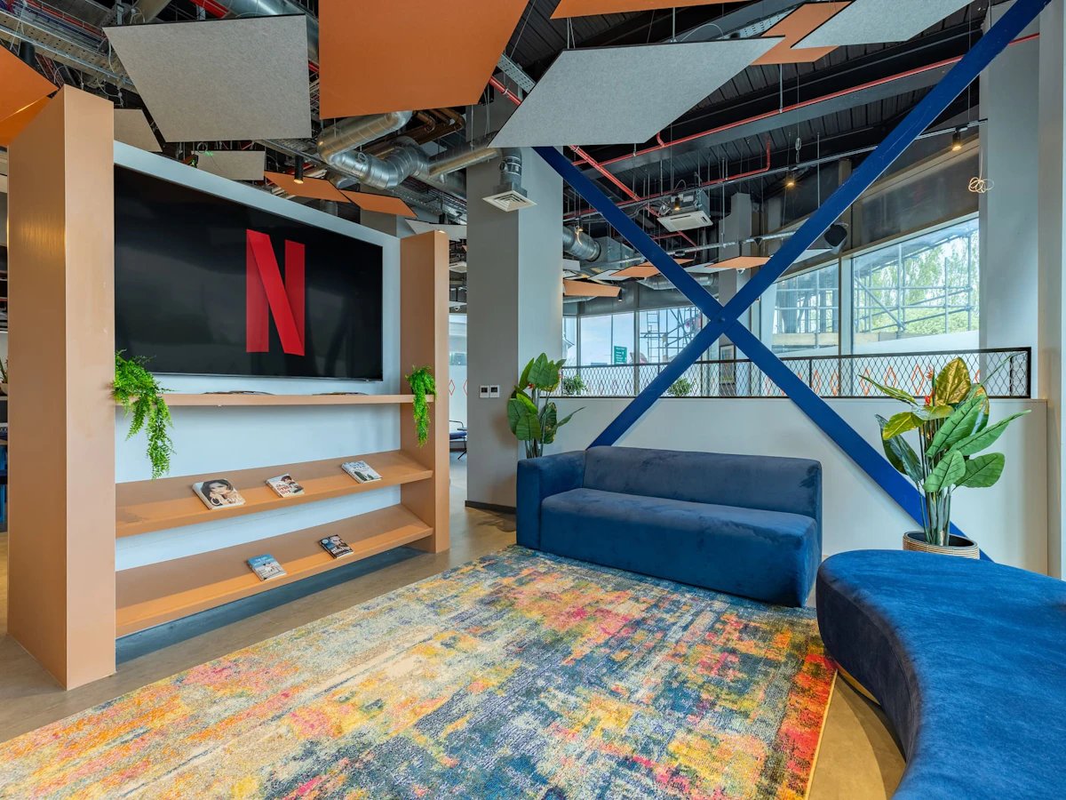 Netflix screen blue sofa colorful rug living room at Limelight in Liverpool Student Accommodation