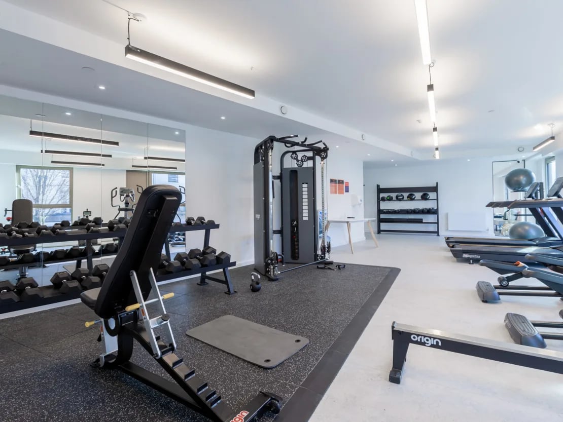 Dumbbells bench treadmill and rowing machine gym at Pavilion Point in Brighton Student Accommodation