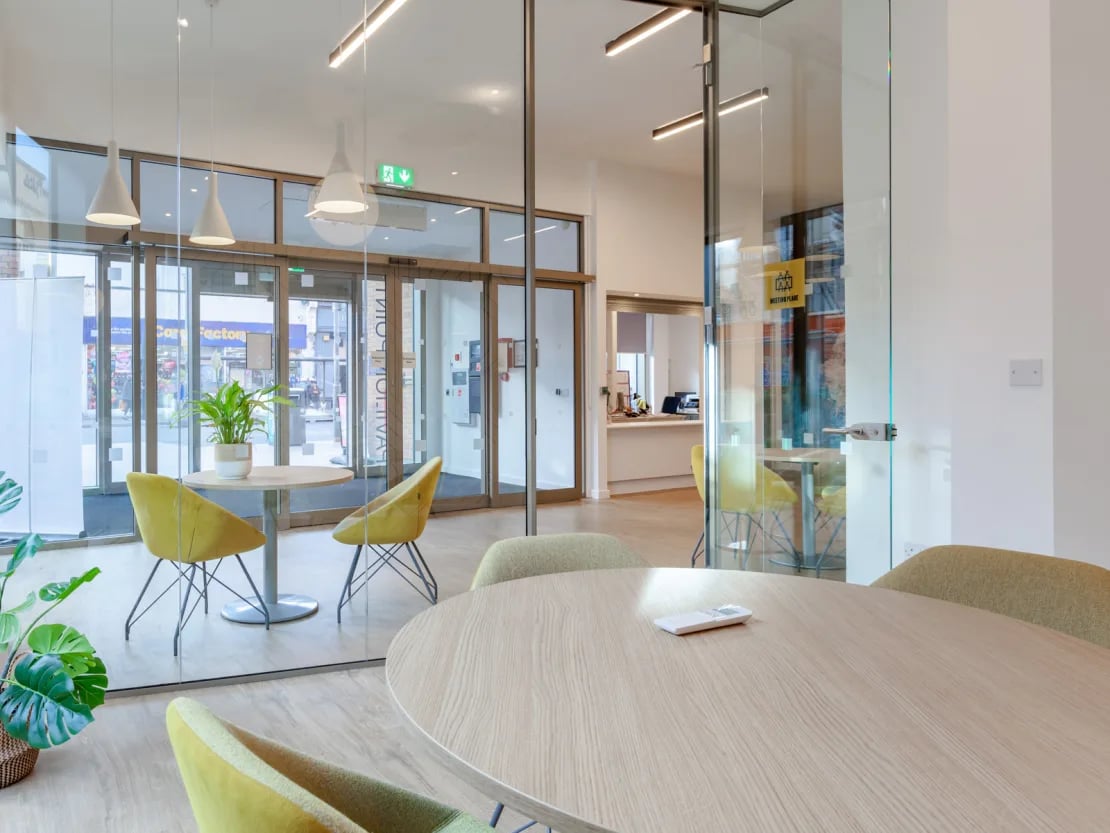 Yellow chairs small table modern communal area at Pavilion Point in Brighton Student Accommodation