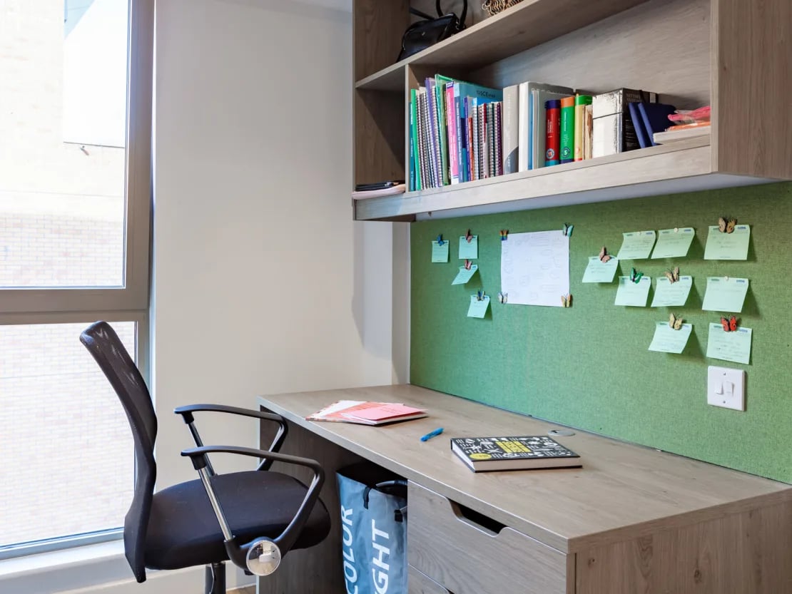 Desk chair books notes and stationery study area at Pavilion Point in Brighton Student Accommodation