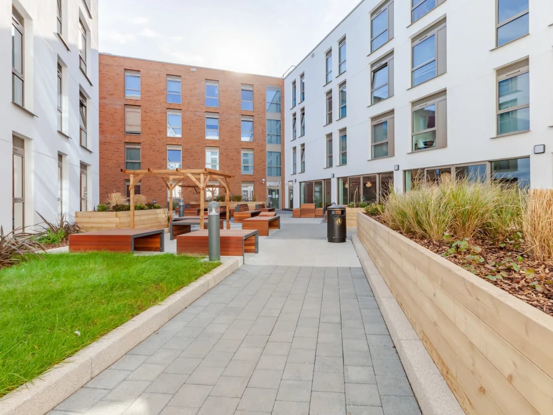 Courtyard with benches and planter exterior at Pavilion Point in Brighton Student Accommodation