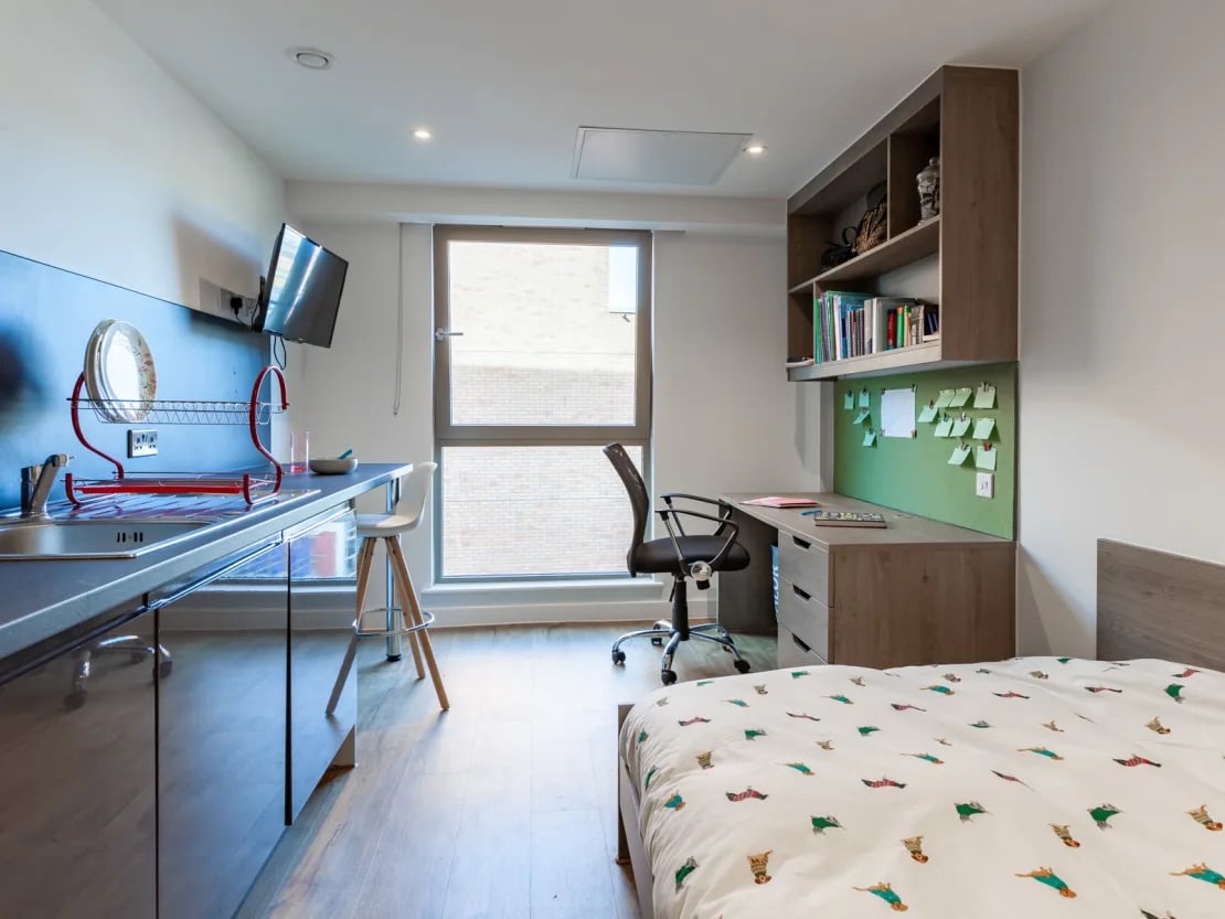 Bed desk kitchen and television study area at Pavilion Point in Brighton Student Accommodation