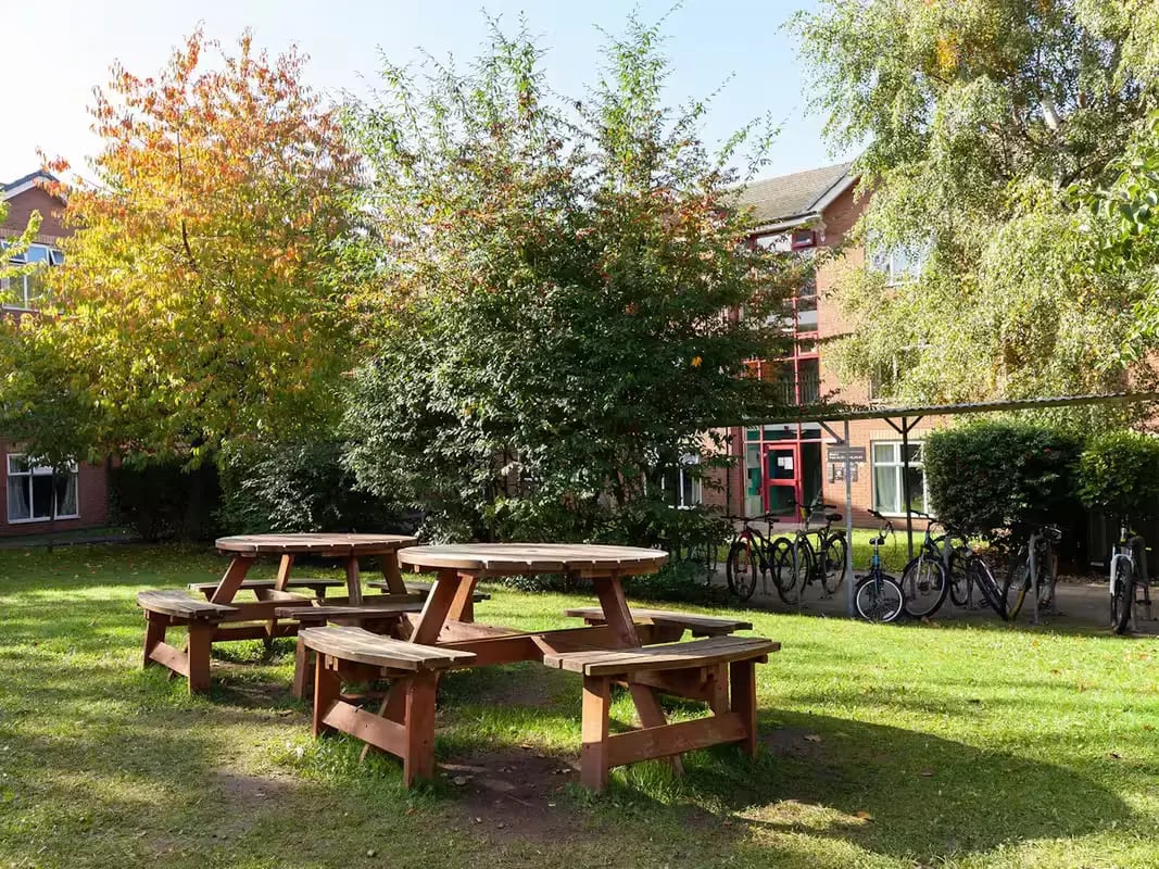 Picnic tables bicycles student accommodation exterior at Paddington Park House in Liverpool Student Accommodation