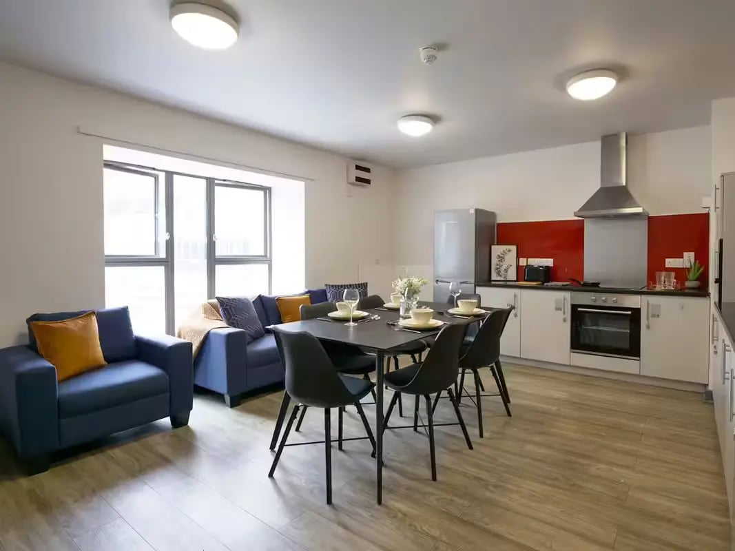 Sofa dining table kitchen living room kitchen at Paddington Park House in Liverpool Student Accommodation