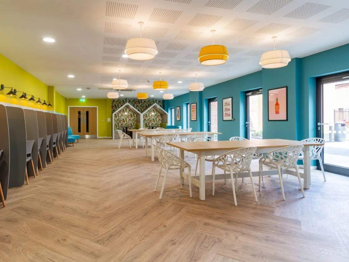 Study carrels tables chairs modern common area at Gulson Gardens in Coventry Student Accommodation