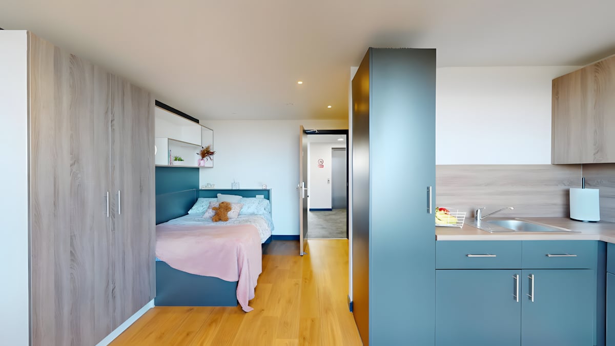 Bed kitchen cabinets and sink studio apartment at Innovo House in Liverpool Student Accommodation