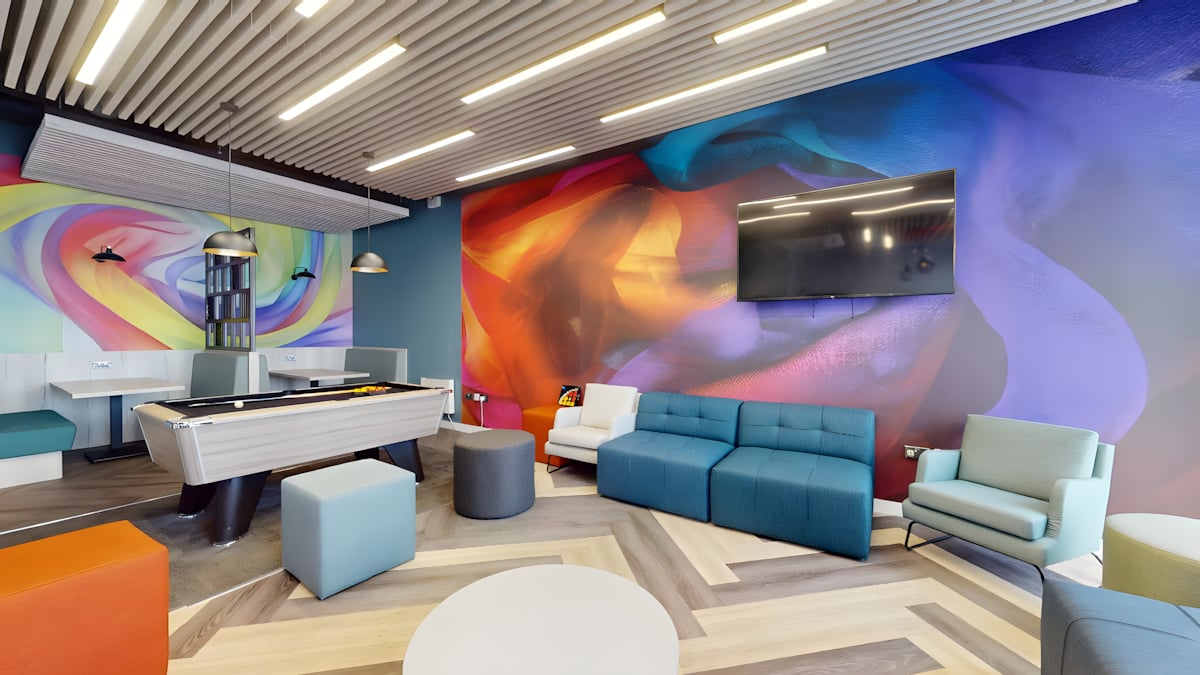Pool table sofas colorful mural lounge area at Innovo House in Liverpool Student Accommodation