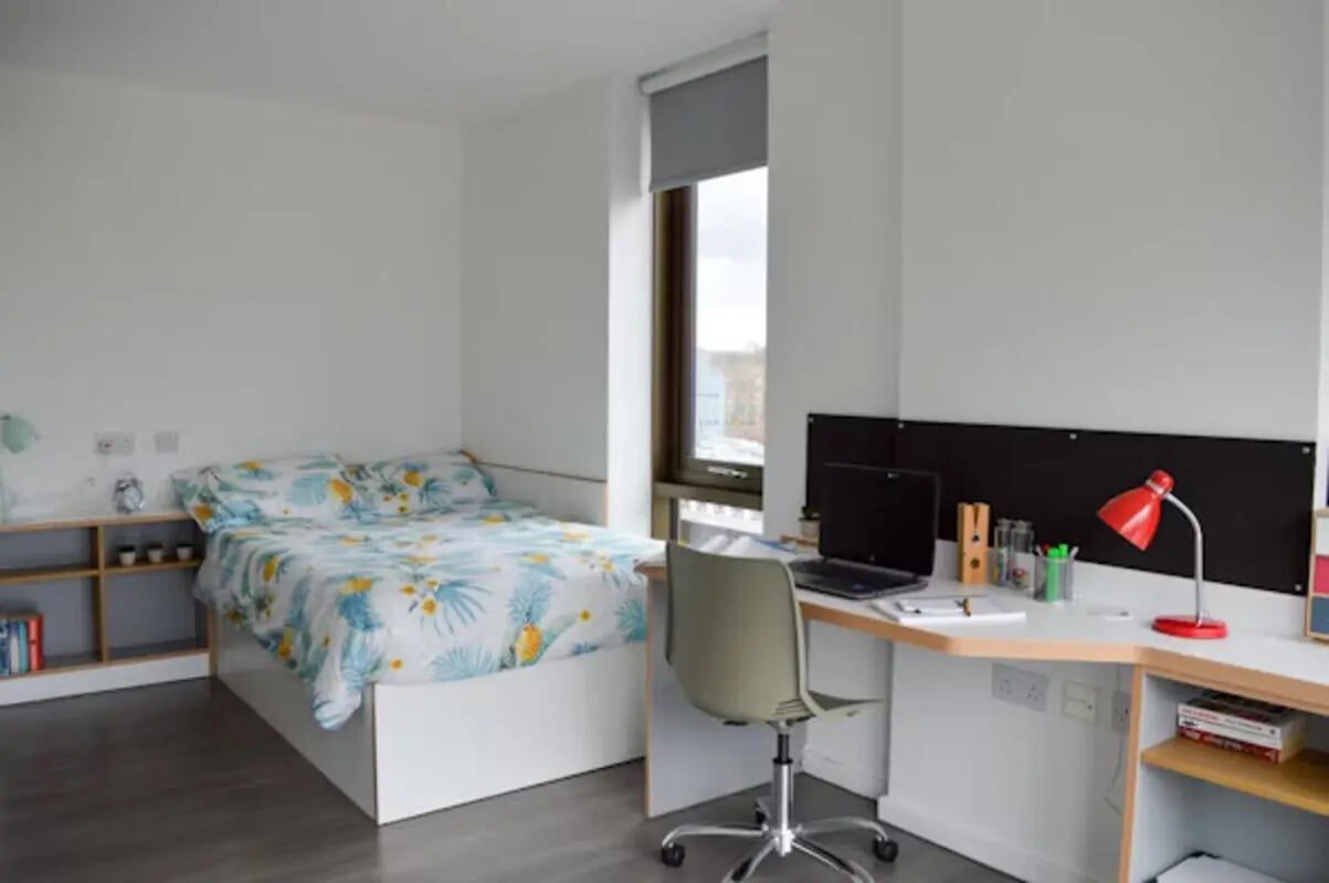 Bed laptop desk chair shelf study area bedroom at Byrom Point in Liverpool Student Accommodation