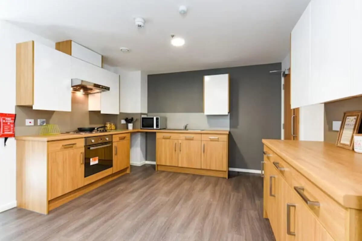 Modern student accommodation kitchen with appliances and cabinets Kitchen at Byrom Point in Liverpool Student Accommodation