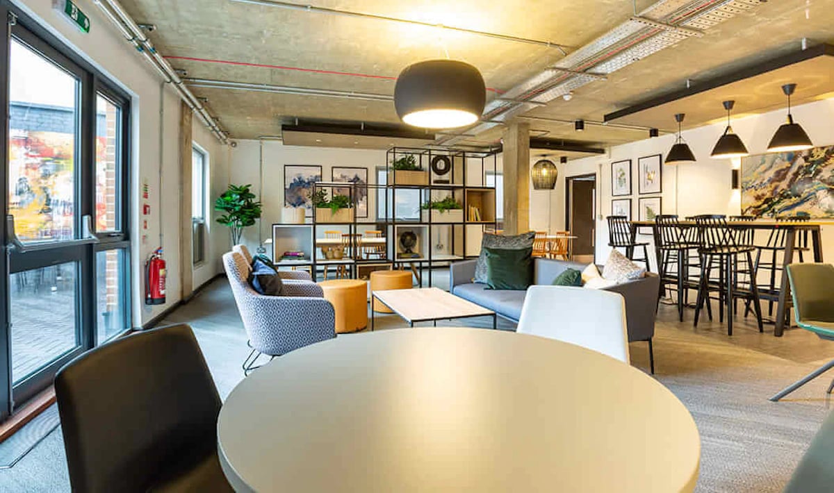 Sofas tables chairs shelves artwork living room at Westcombe House in London Student Accommodation