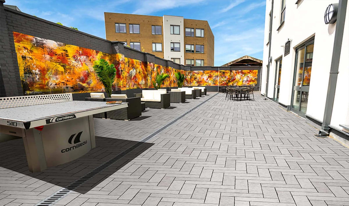 Ping pong table outdoor seating and artwork Exterior at Westcombe House in London Student Accommodation