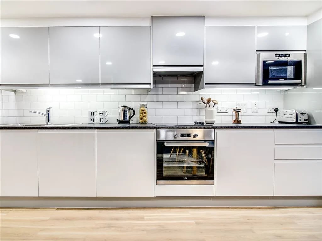 Modern kitchen with oven microwave kettle and toaster kitchen at New Orient House in London Student Accommodation