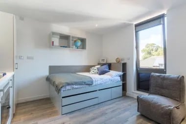 Bed desk shelving beanbag student room at Glendower House in Cardiff Student Accommodation